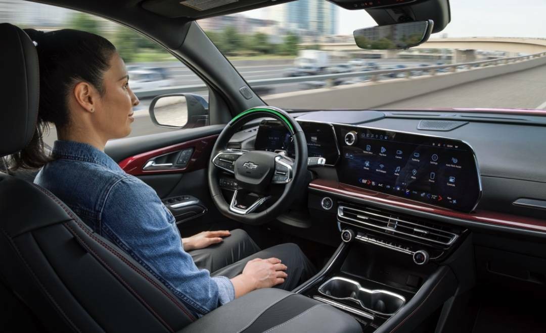 Woman Driving in her GM Vehicle Using Super Cruise Hands-Free Driving