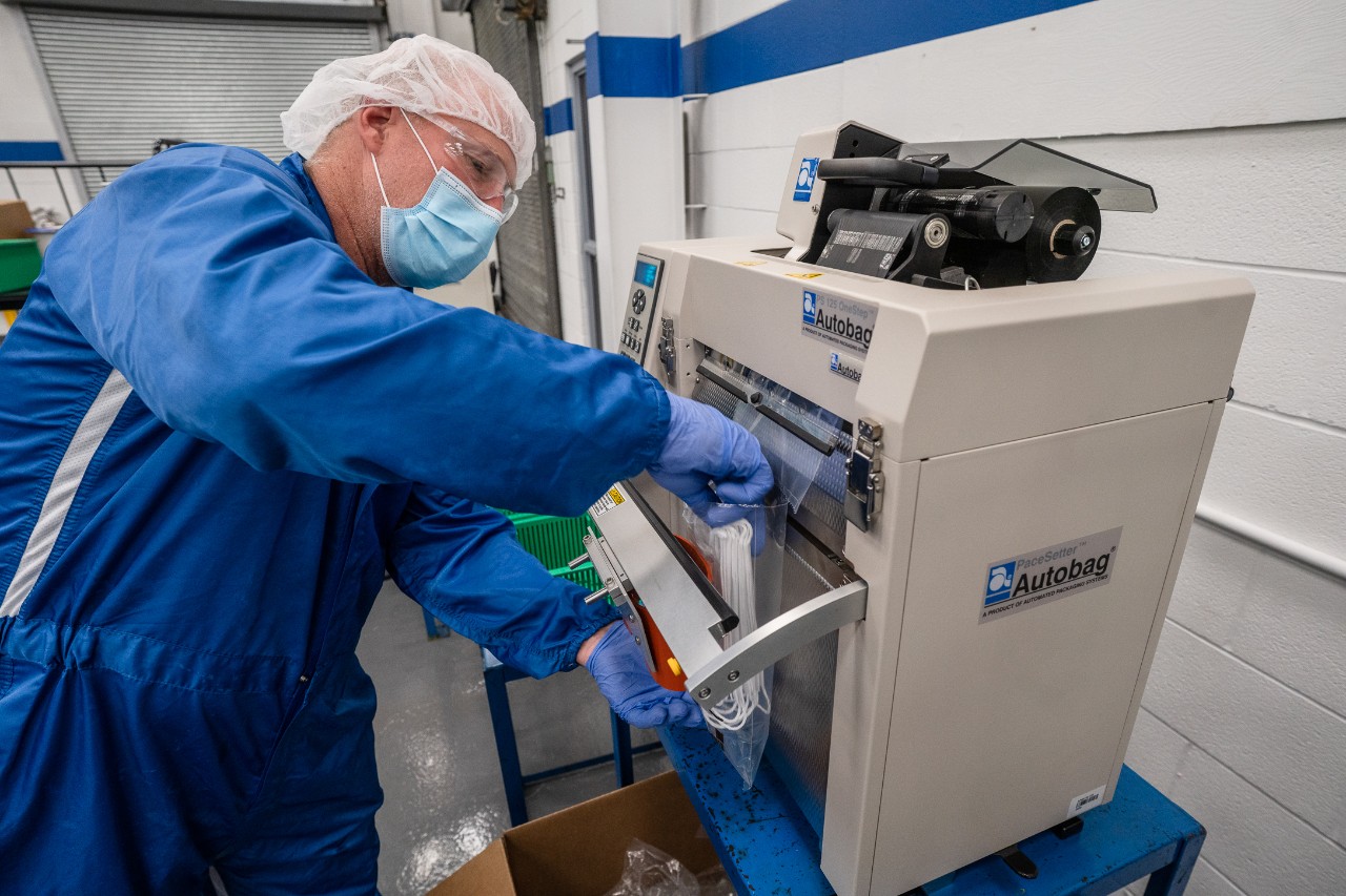 Man Charging His Chevrolet Bolt EV at an EVgo Charging Statio