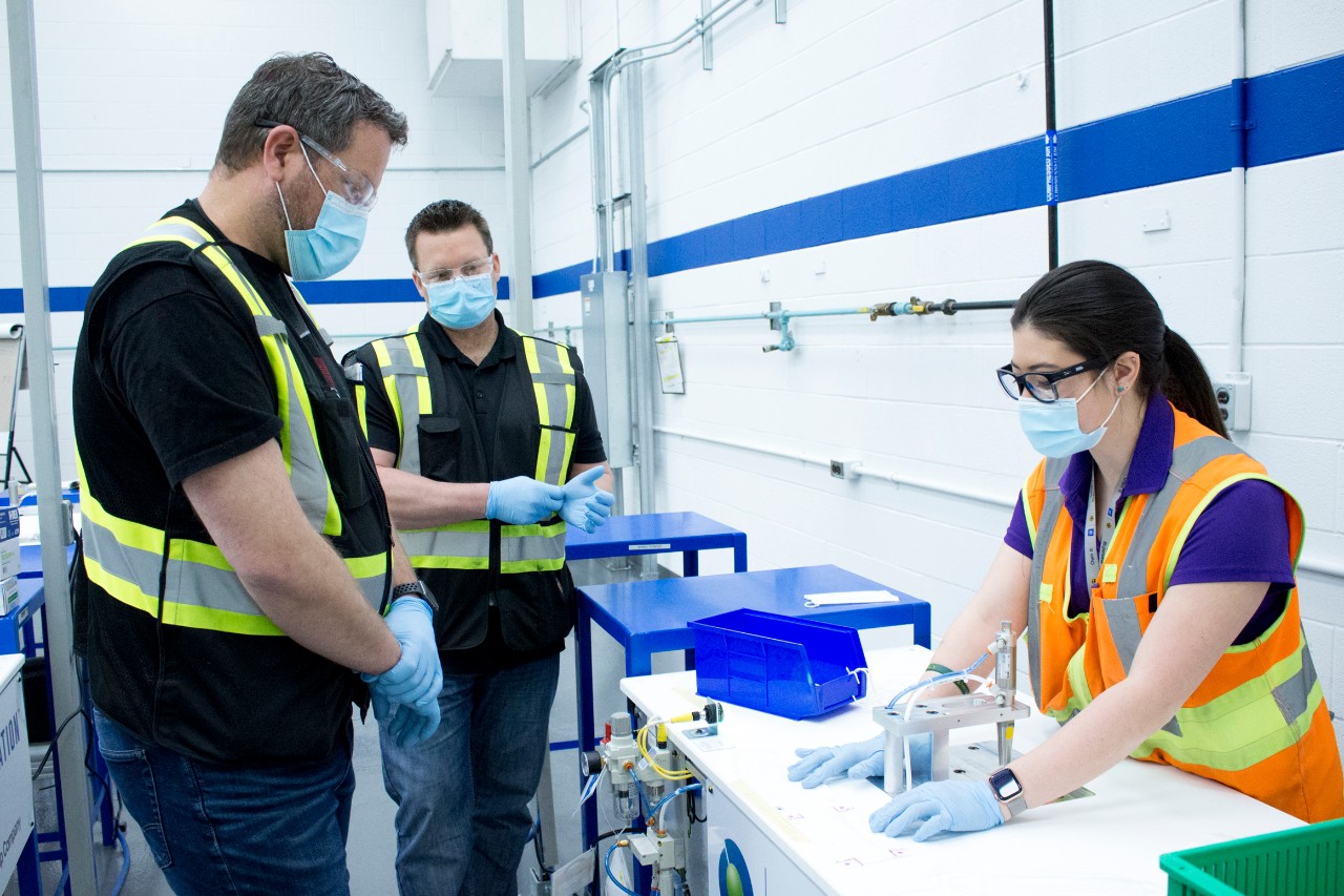 Man Charging His Chevrolet Bolt EV at an EVgo Charging Statio